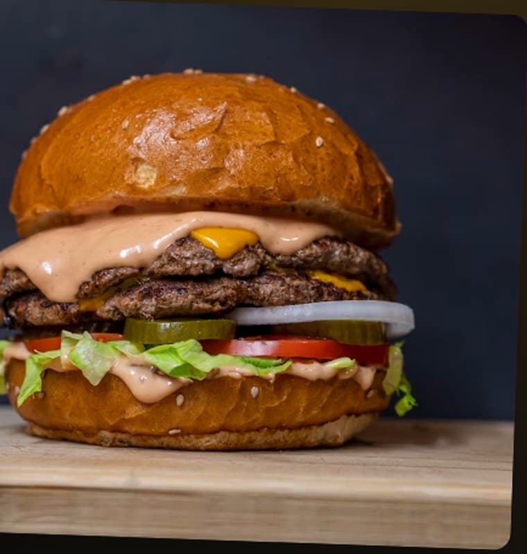 Double Smash burger stacked with cheese, onion and pickles