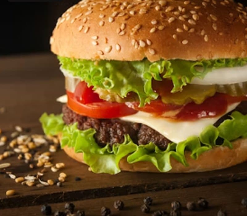 Harissa Smash burger with lettuce, tomato and melted cheese